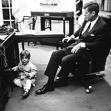 President John F. Kennedy sitting in a Gunlocke chair 