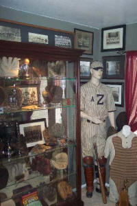 Vintage Trophies and Baseball Uniform collectables display